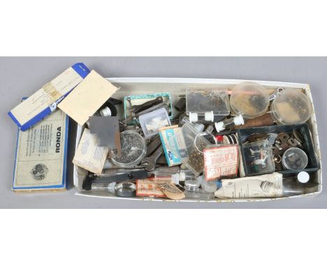 A tray of watch makers tools and spares.