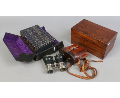 A cased set of 11 volumes of the Holy Bible along with a Victorian mahogany tea caddy and a cased set of antique French binoc