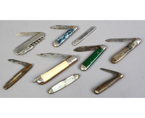 A box of penknives including examples with mother of pearl scales.