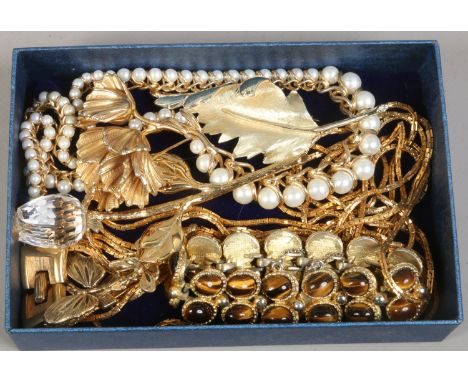 A box of designer and vintage costume jewellery including Trifari etc.