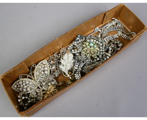 A box of assorted white paste vintage jewellery including necklets and brooches etc.