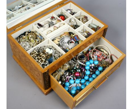 A jewellery case containing assorted modern and vintage costume jewellery.