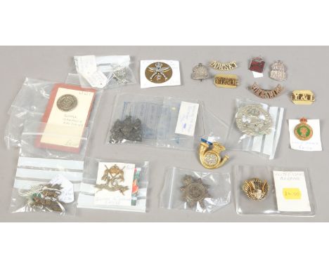 A collection of military badges including United States Airborne Badge, Infantry of line Worchestershire and World War I Roya