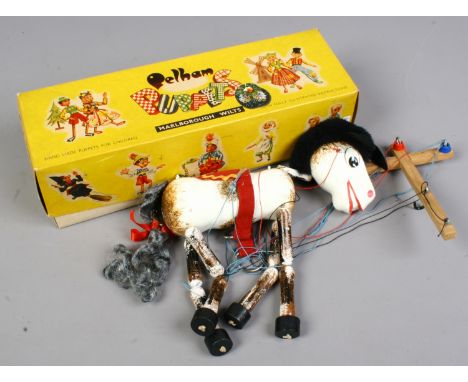 A boxed Muffin the mule Pelham puppet.