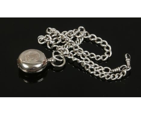 A silver Albert watch chain and a silver plated sovereign case.