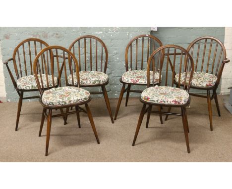 A set of six Ercol spindle back dining chairs including two carvers.