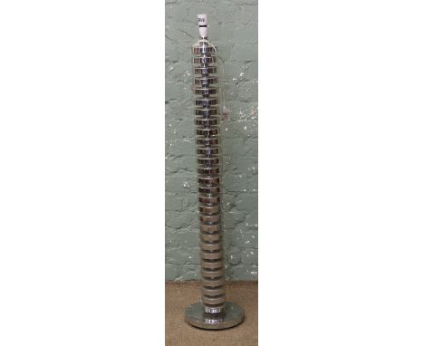 An unusual chrome standard lamp.