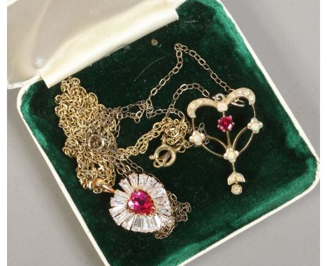 A Victorian silver gilt opal set pendant on chain and another silver gilt gem set pendant on chain.