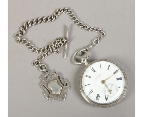 A Victorian silver cased fusee pocket watch with white enamel dial and subsidiary seconds on silver graduated Albert chain wi