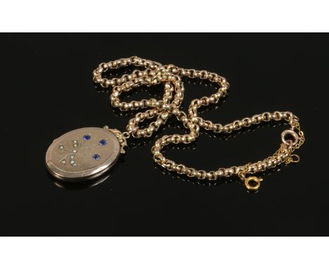 A 9ct gold chain and gold plated locket set with blue paste stones and seed pearls, gross weight 17 grams.