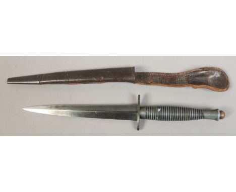 A World War II Fairbairn Sykes MKIII commando knife. Scabbard tip mild steel.