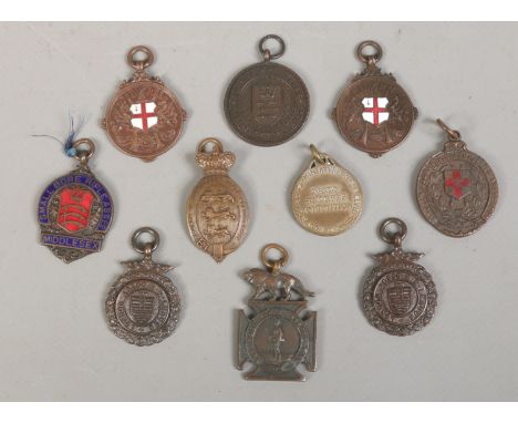 Ten rifle medal fobs including enamel examples including The Army Rifle Ass, Small Bore Rifle Ass and County of Lancaster Rif