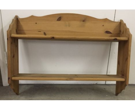 Pine shelf unit for wall mounting.