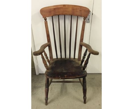 Antique wooden stick back chair.