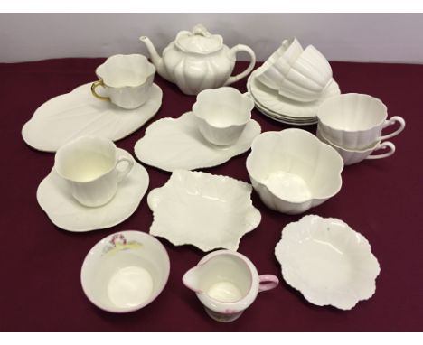 A quantity of Shelley tea wares to include 2 tennis cups & saucers and a tea for one tea pot.