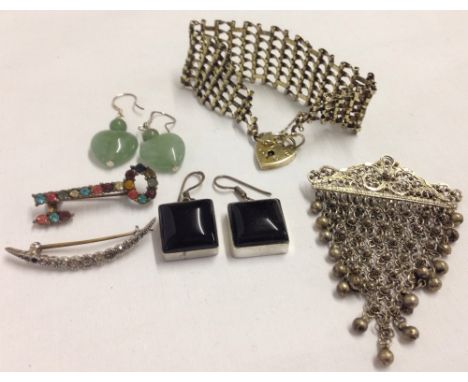 A collection of silver jewellery comprising 2 pairs of silver drop earrings (a square pair set with black stones and a pair o