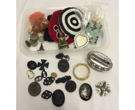 A collection of miscellaneous items to include hand beaded purses, a Ronson 'Crown' table lighter, a handpainted fan decorate