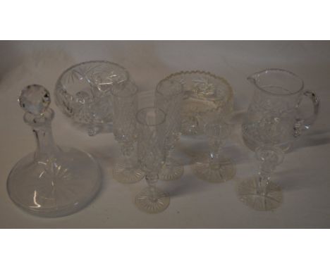 Glassware including a ships decanter, two bowls, pair of candlesticks, 3 champagne flutes etc