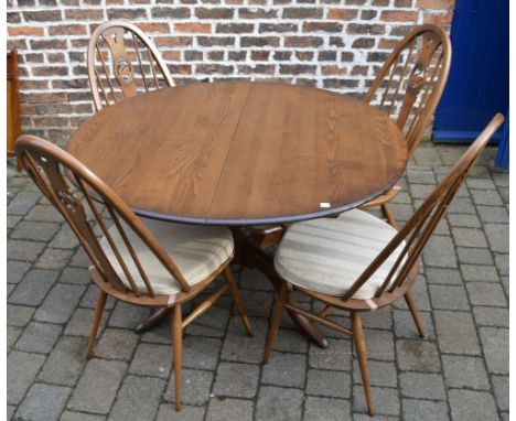 4 Ercol swan back chairs and a draw leaf table
