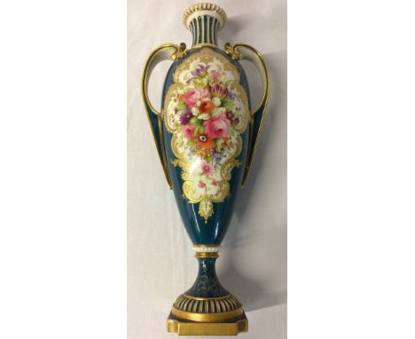 Royal Worcester two handled vase hand decorated with floral cartouche signed H Chair & ornate gilding on a blue/green ground.