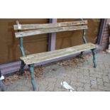 A metal and wooden slatted garden bench.