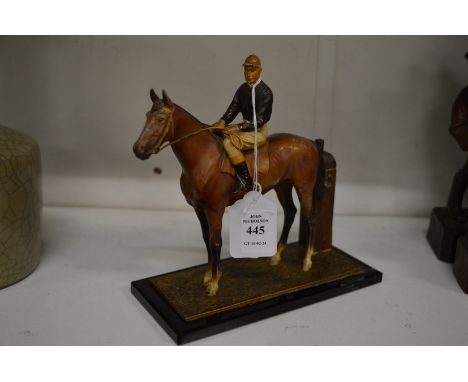 A painted Spelter table lighter modelled as a horse and jockey.