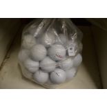 A bag of fifty Pinnacle golf balls.