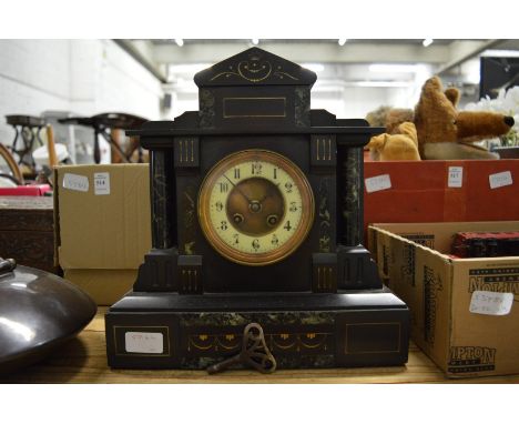 A Victorian slate mantel clock.