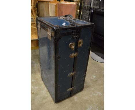 A wardrobe trunk.