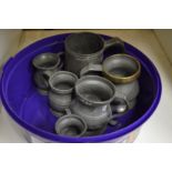 A small group of pewter tankards.