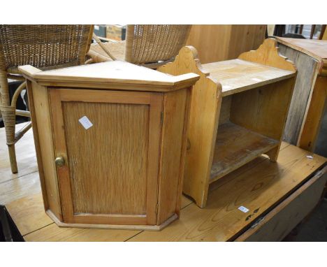 A small pine shelf and hanging corner cupboard.