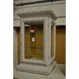 Decoratively painted table top display cabinet.