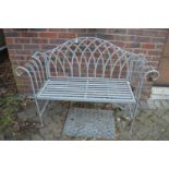 A Regency style wrought iron garden bench.