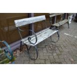 A metal and wooden slatted garden bench.