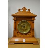 An oak cased mantel clock.