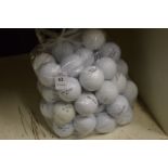 A bag of fifty Top-Flite golf balls.
