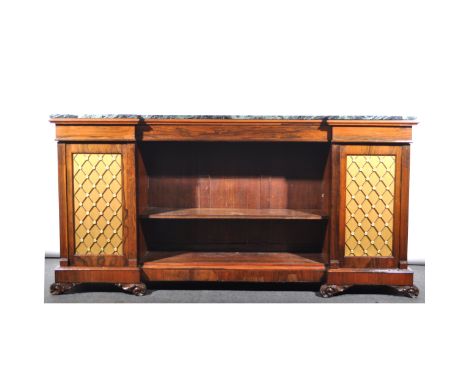 A Regency rosewood breakfront bookcase, variegated marble top, plain frieze, with concealed drawer, above an open adjustable 