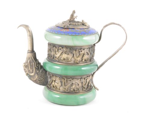 A small Chinese white metal mounted teapot with three jadeite bands between two metal paneles depicting dragons, blue cloison