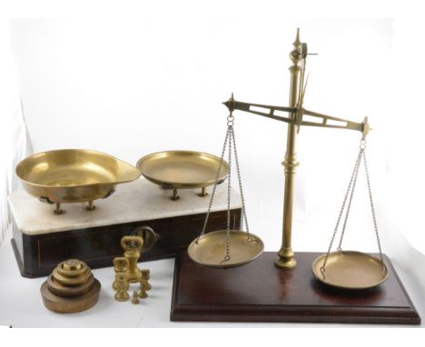 A set of platform scales, Arnell &amp; Sons, brass pans, marble platform, 49cm; and a set of brass balance scales with weight