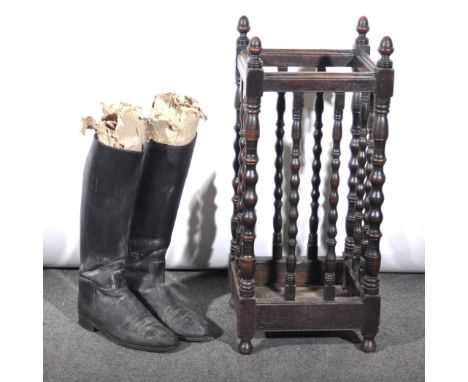 An oak stick-stand, square section, bobbin-turned uprights, width 34cm; and a pair of old leather riding boots, (3).