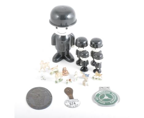 A small selection of die-cast models by Corgi, Dinky and others, enamel badge, oher badges, plastic figure of Fred from Homep