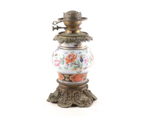 A Victorian cast metal and English ironstone lamp, vase shape, painted in Imari colours, 36cm.