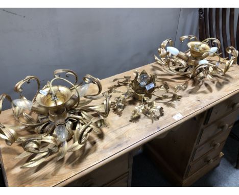 A gilt painted five light chandelier, scrolled arms spaced with flower head motifs, 52cm drop; and a pair of centre light fit