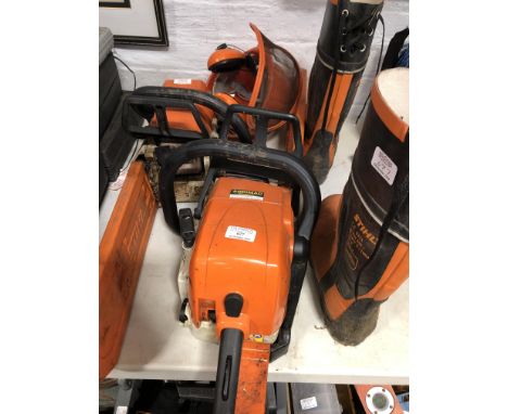 Stihl MS290 chainsaw; Stihl 25 chainsaw; safety helmet; and boots.