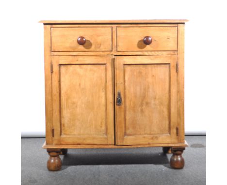 A stripped pine cabinet, two drawers over two panelled doors, width 91cm; with a matched two shelf delft rack, overall height