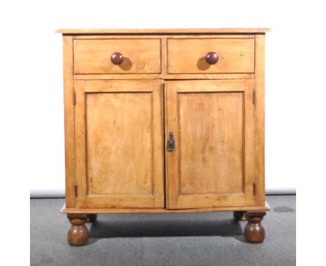 A stripped pine cabinet, two drawers over two panelled doors, width 91cm; with a matched two shelf delft rack, overall height