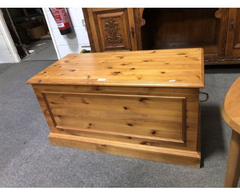 A modern pine blanket box, rectangular hinged lid, bracket feet, height 47cm, width 91cm.