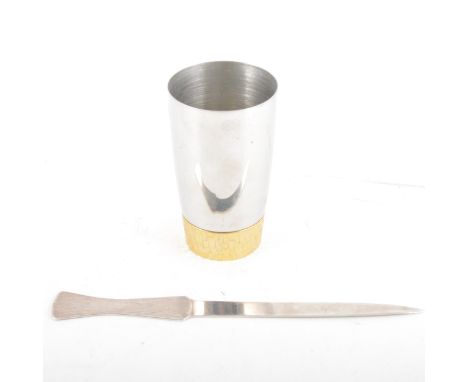 Silver letter knife, S. J. Rose &amp; Son., London, 1973, 23cm; and a stainless steel and parcel gilt beaker, designed by Stu