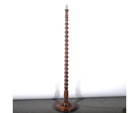 An oak standard lamp, barley twist column, circular base, 153cm.