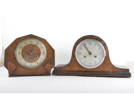 An oak cased mantel clock, silvered chapter ring, movement striking on a gong; and another oak cased mantel clock, (2)